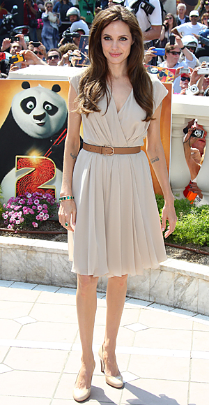Angelina Jolie in a beige chiffon dress with a letaher belt